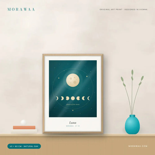 Luna Moon Phases Framed Art Print in a natural oak frame on a shelf